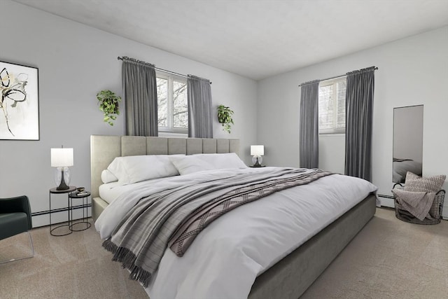 bedroom featuring baseboard heating and light carpet