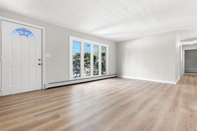 entrance foyer featuring a baseboard radiator and light wood-type flooring