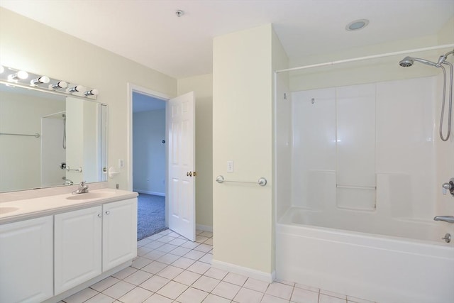 full bathroom featuring tile patterned flooring, double vanity, baseboards, shower / tub combination, and a sink