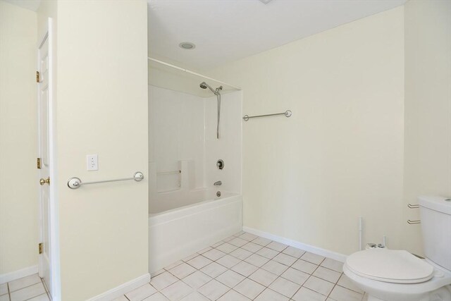 bathroom featuring baseboards, tile patterned floors, toilet, and shower / tub combination