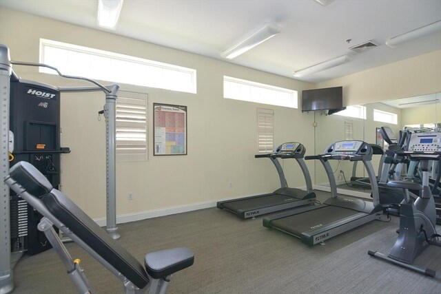 workout area with baseboards and visible vents