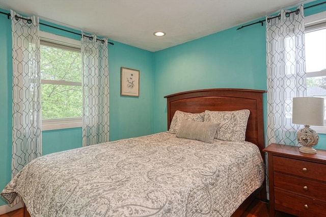 bedroom featuring wood finished floors and recessed lighting