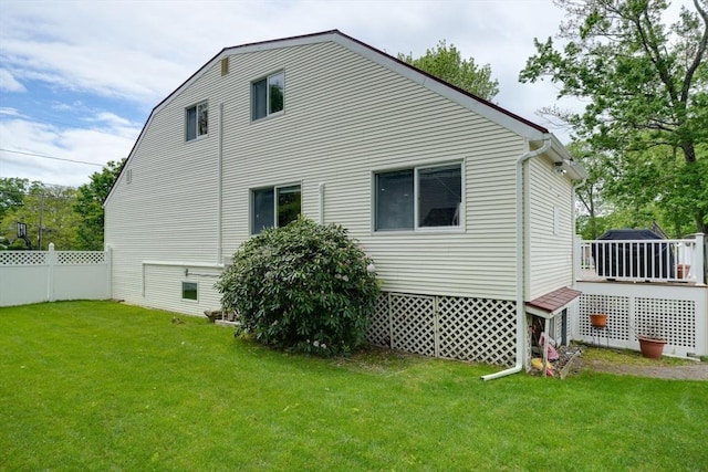 view of side of home with a deck