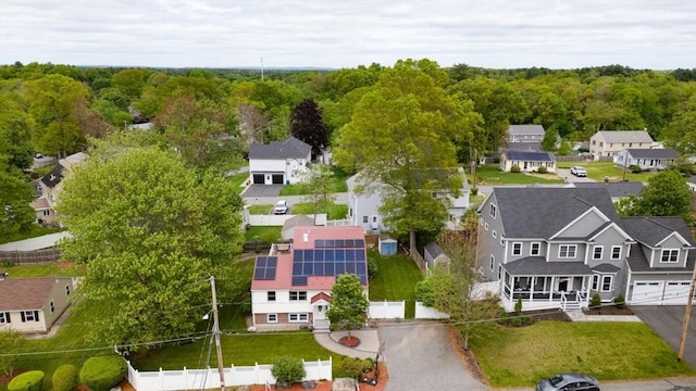 aerial perspective of suburban area with a heavily wooded area