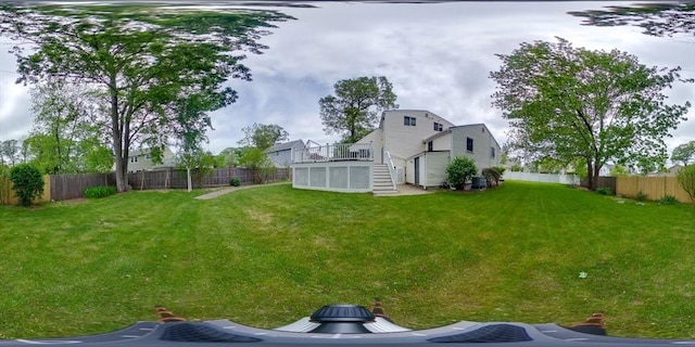 view of yard featuring stairway and a deck