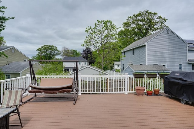 wooden terrace with grilling area