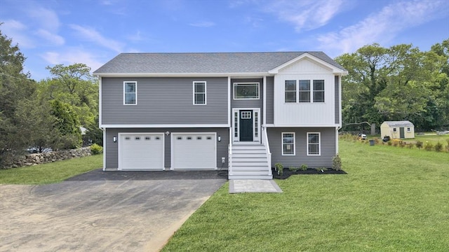 96 Bryant St, Dartmouth, MA 02747 - bi-level home featuring driveway, a garage, and a front yard