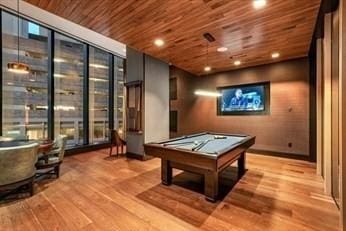 recreation room with pool table, wooden ceiling, floor to ceiling windows, and wood finished floors