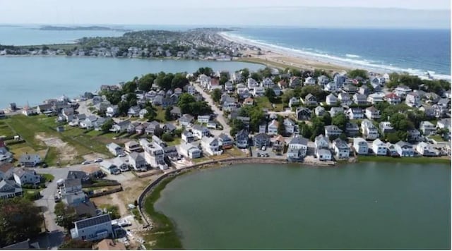 bird's eye view featuring a beach view and a water view