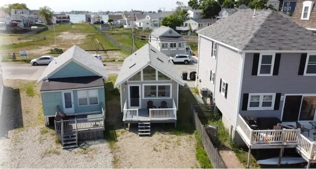 back of property featuring a wooden deck