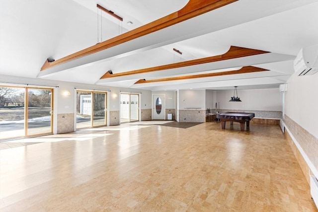 workout room featuring a wainscoted wall, lofted ceiling, wood finished floors, and pool table
