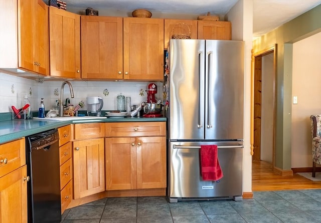 kitchen with high quality fridge, dishwasher, sink, and decorative backsplash