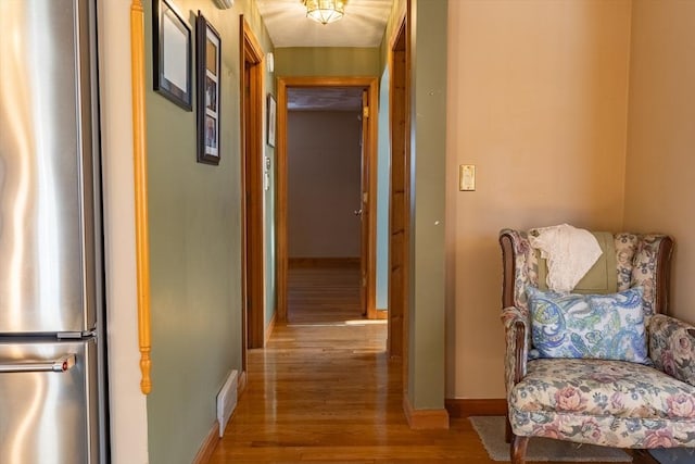 hallway featuring light hardwood / wood-style flooring