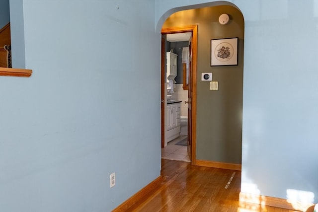 hallway with light wood-type flooring