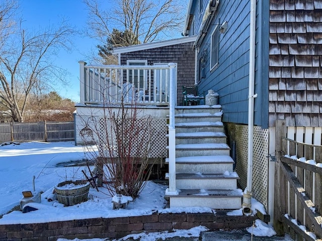 view of snow covered property entrance