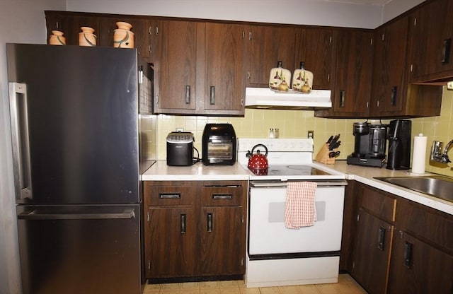980 Plain St Unit 4, Marshfield, MA 02050 - kitchen featuring freestanding refrigerator, electric range, under cabinet range hood, and light countertops