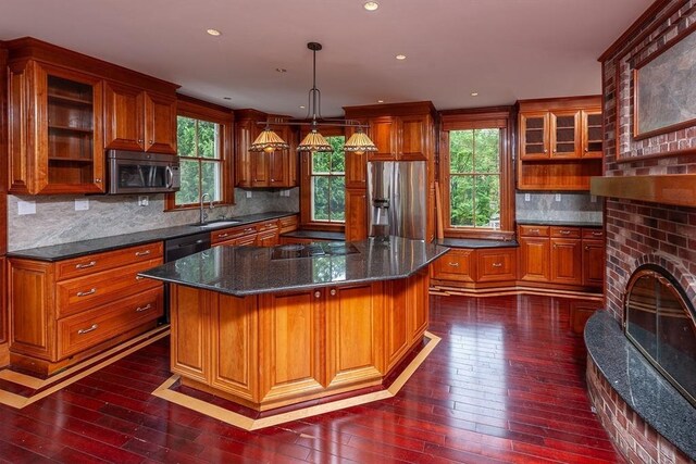 65 Central St, Andover, MA 01810 - kitchen featuring stainless steel appliances, a sink, dark wood-style floors, plenty of natural light, and recessed lighting