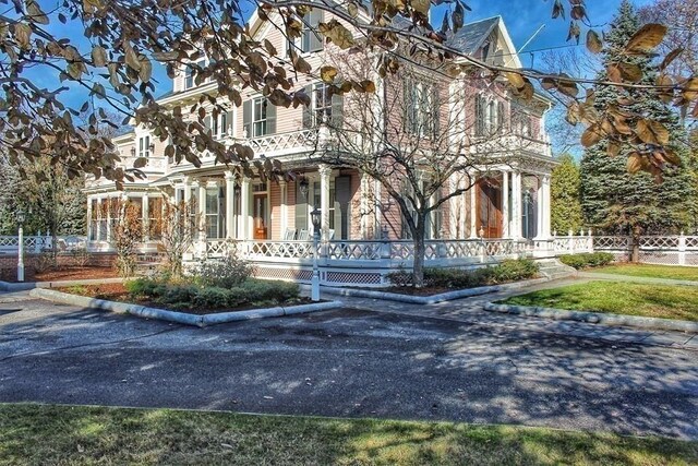 65 Central St, Andover, MA 01810 - view of front of house with covered porch and fence