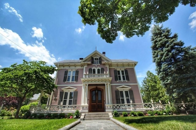 65 Central St, Andover, MA 01810 - italianate home featuring covered porch and a front lawn