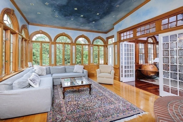 65 Central St, Andover, MA 01810 - sunroom with plenty of natural light, crown molding, a towering ceiling, wood finished floors, and french doors