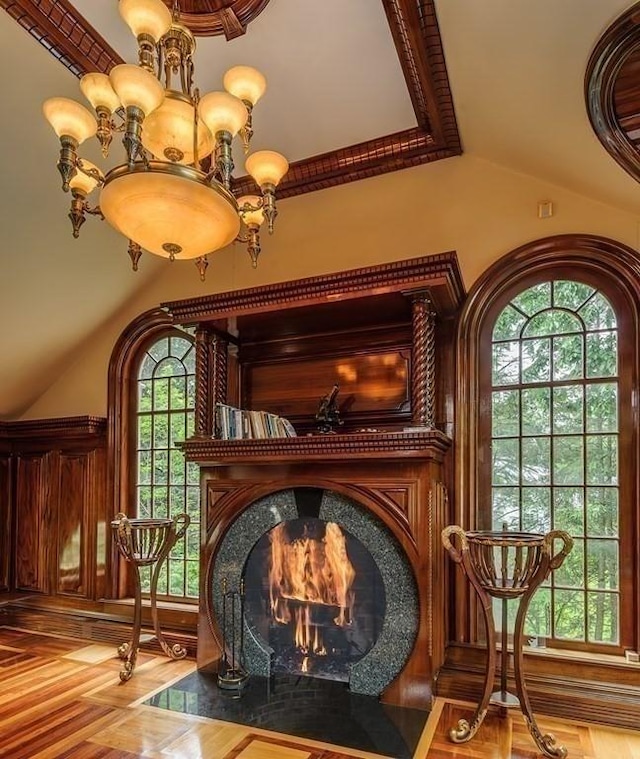 65 Central St, Andover, MA 01810 - sitting room featuring healthy amount of natural light, vaulted ceiling, a chandelier, and a high end fireplace