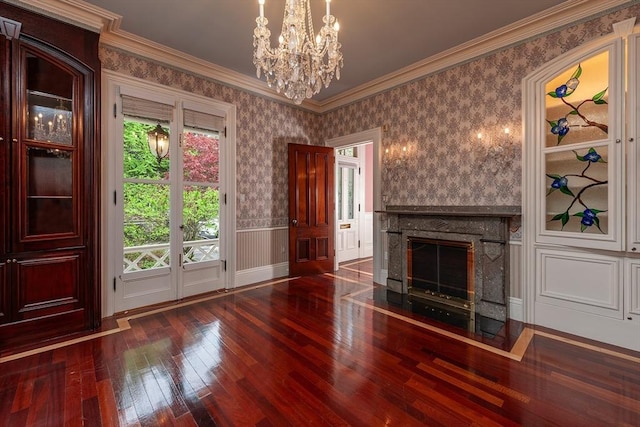 65 Central St, Andover, MA 01810 - unfurnished living room featuring hardwood / wood-style flooring, a chandelier, a high end fireplace, crown molding, and wallpapered walls