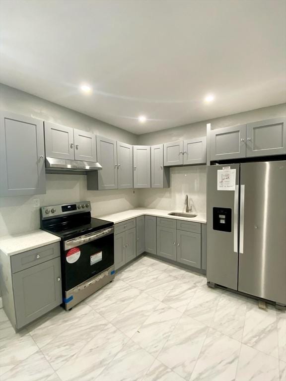 kitchen with gray cabinets, sink, and appliances with stainless steel finishes