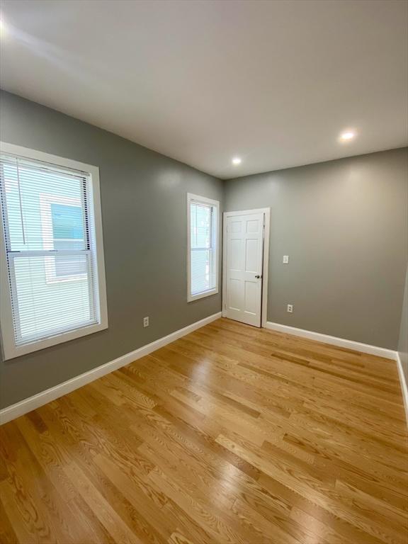 spare room with light hardwood / wood-style floors