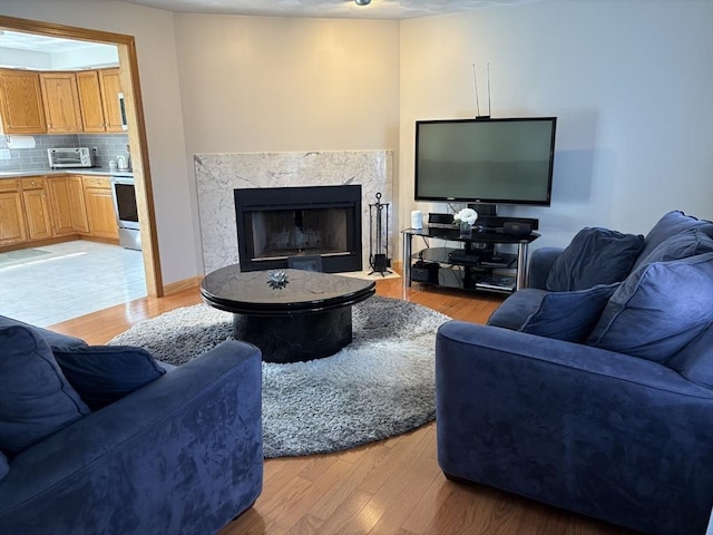 75 Lake St, Rehoboth, MA 02769 - living room featuring light wood-style floors and a high end fireplace