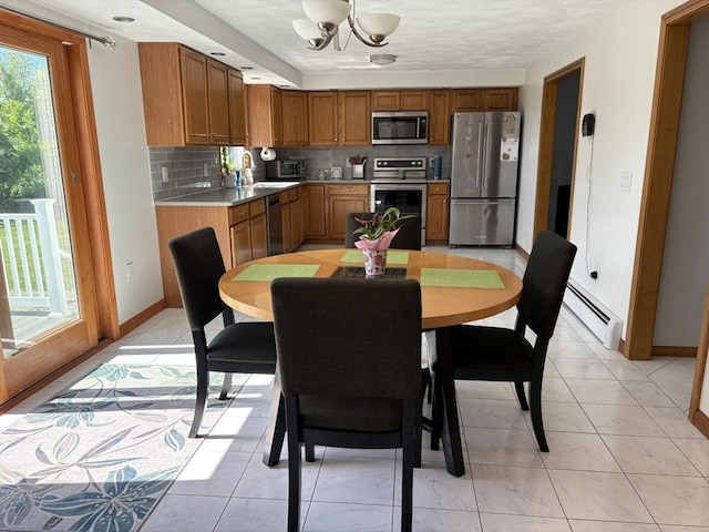 75 Lake St, Rehoboth, MA 02769 - dining space with a baseboard heating unit, a chandelier, and baseboards