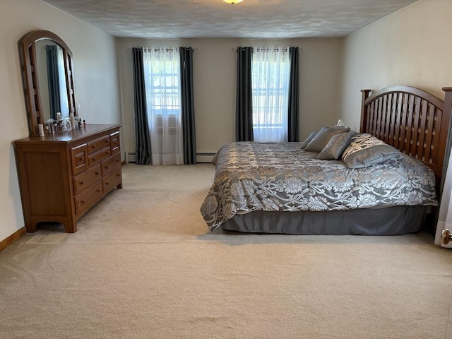 75 Lake St, Rehoboth, MA 02769 - bedroom featuring light carpet, multiple windows, baseboards, and a baseboard radiator