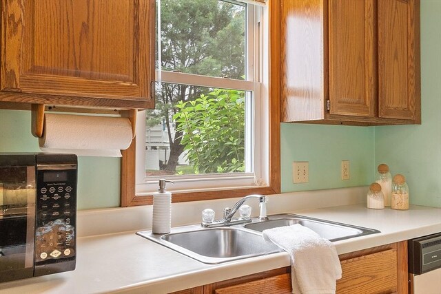 165 Bayberry Hill Ln Unit 165, Leominster, MA 01453 - kitchen featuring light countertops, dishwasher, and brown cabinets