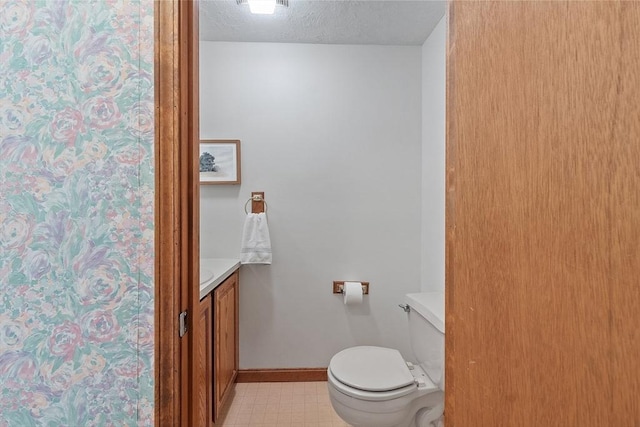 165 Bayberry Hill Ln Unit 165, Leominster, MA 01453 - bathroom featuring vanity, a textured ceiling, and tile patterned floors
