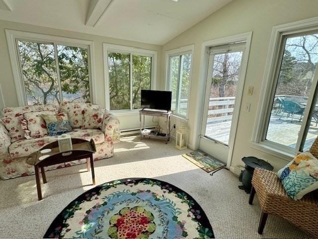 sunroom / solarium featuring carpet flooring, lofted ceiling, and a healthy amount of sunlight