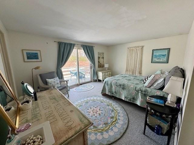 bedroom with carpet floors and access to outside