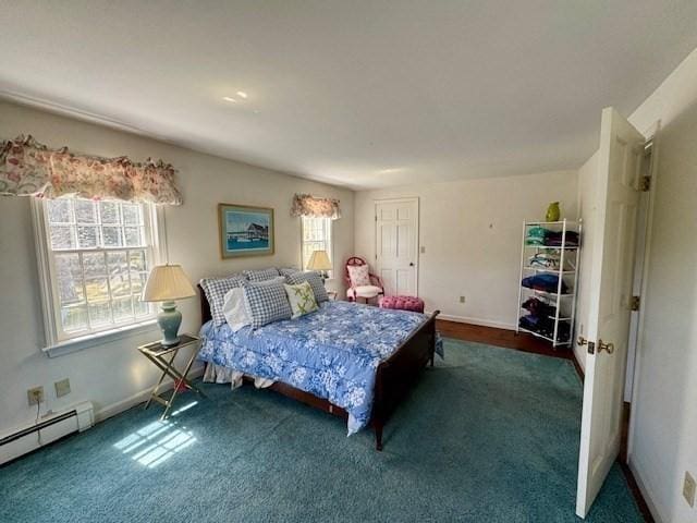 carpeted bedroom featuring baseboards and a baseboard radiator