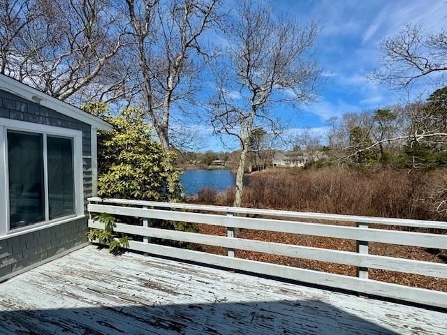 wooden deck featuring a water view