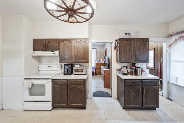 kitchen with dark brown cabinets and electric stove