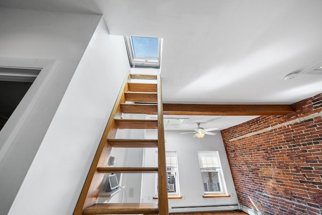 31 Division St # 3, Chelsea, MA 02150 - staircase featuring a baseboard radiator, a skylight, and a ceiling fan