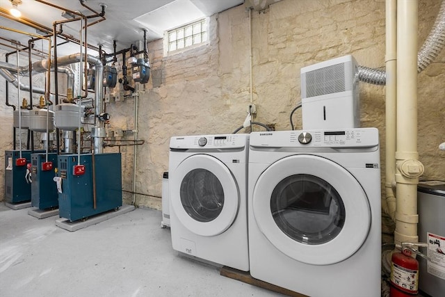 31 Division St # 3, Chelsea, MA 02150 - washroom featuring washing machine and dryer, a heating unit, and water heater
