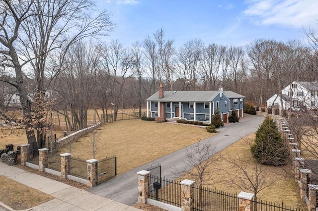 2171 Commonwealth Ave, Newton, MA 02466 - view of front facade with covered porch, a chimney, driveway, and a gate