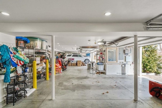2171 Commonwealth Ave, Newton, MA 02466 - garage featuring electric panel, a garage door opener, and recessed lighting