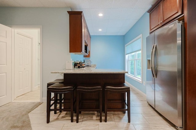 37 Sandy Ridge Rd, Sterling, MA 01564 - kitchen with appliances with stainless steel finishes, a kitchen breakfast bar, recessed lighting, baseboards, and a peninsula