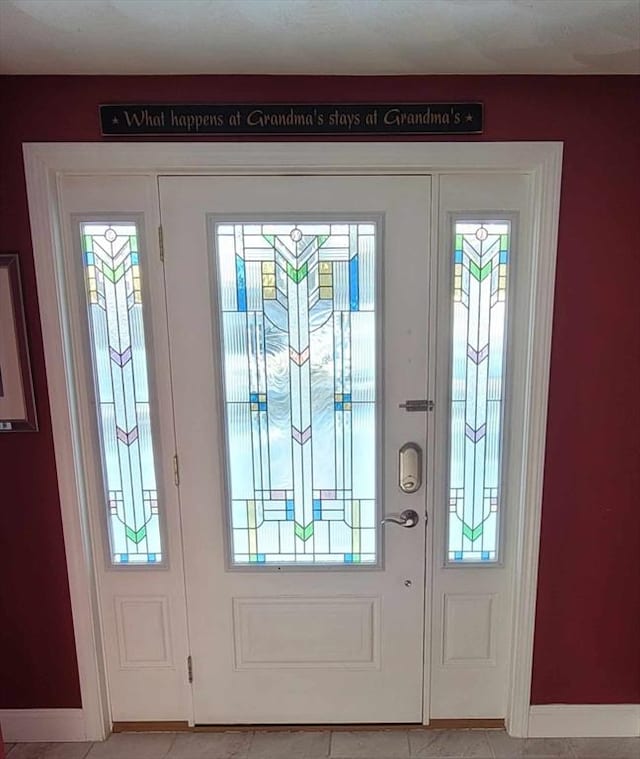 tiled entryway featuring a wealth of natural light