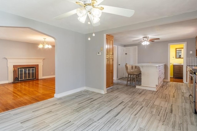 40 Fenimore Blvd, Springfield, MA 01108 - living area featuring a ceiling fan, light wood finished floors, baseboards, and a fireplace