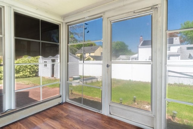40 Fenimore Blvd, Springfield, MA 01108 - unfurnished sunroom featuring a baseboard radiator and plenty of natural light
