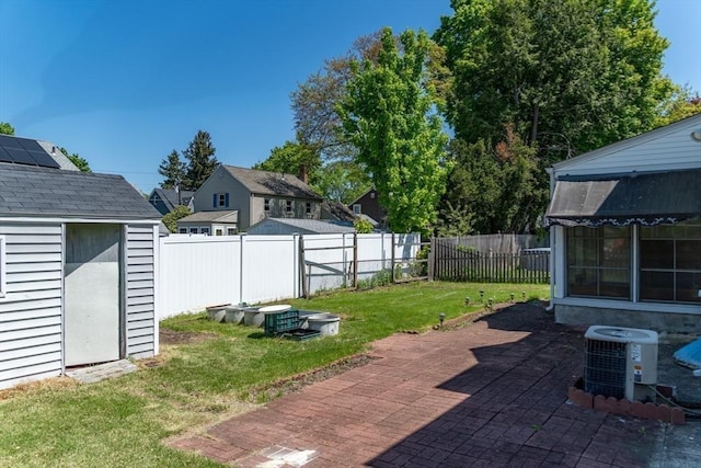 40 Fenimore Blvd, Springfield, MA 01108 - view of patio featuring a storage unit, central AC, and an outdoor structure