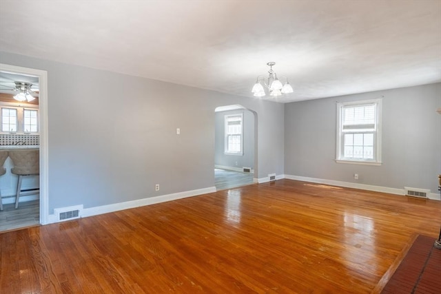40 Fenimore Blvd, Springfield, MA 01108 - unfurnished room featuring arched walkways, wood finished floors, baseboards, and plenty of natural light