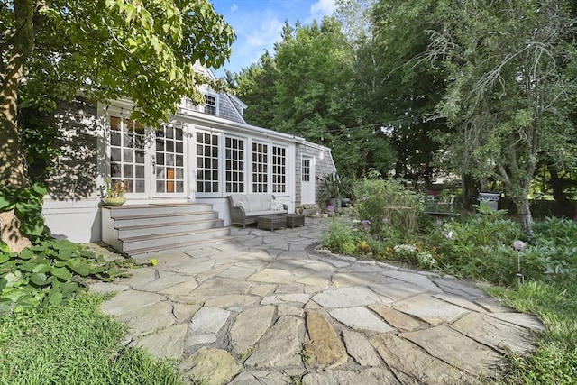 view of patio / terrace with french doors and entry steps