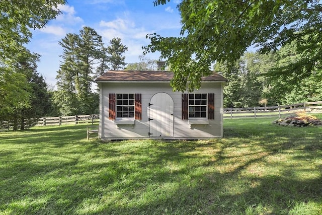 view of shed with fence